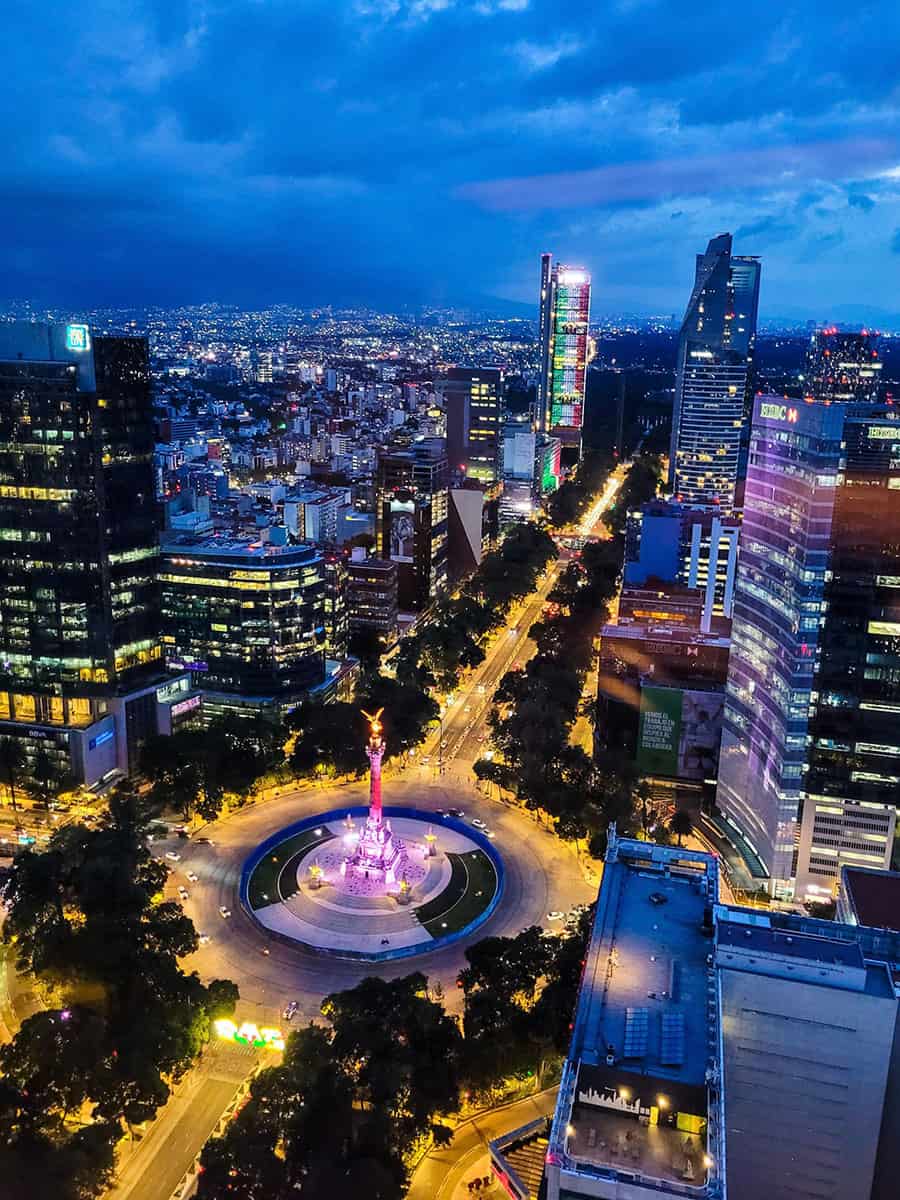 The view from Cityzen Rooftop Kitchen looking out over the city lights and Angel of Independence in Mexico City.